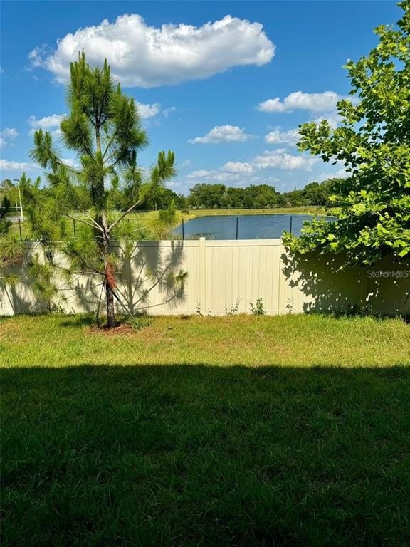 4561 Small Creek Road Kissimmee, FL 34744 - Photo 27 of 32 a view of a golf course with a lake