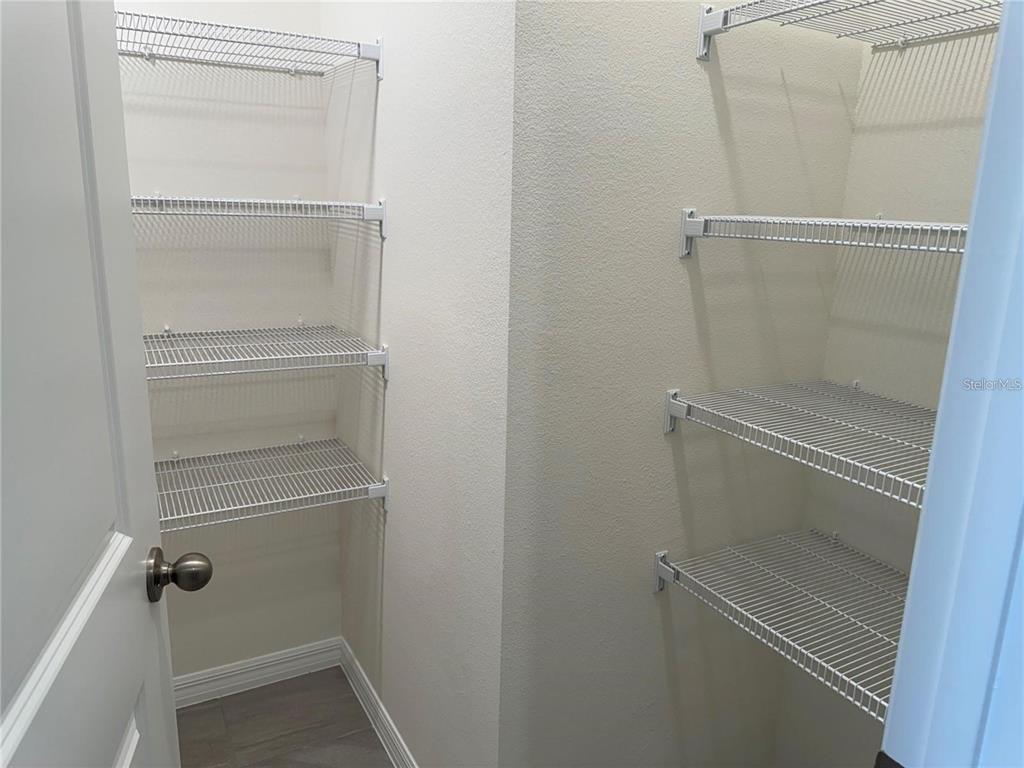 4561 Small Creek Road Kissimmee, FL 34744 - Photo 8 of 32 a bathroom with a glass door shower