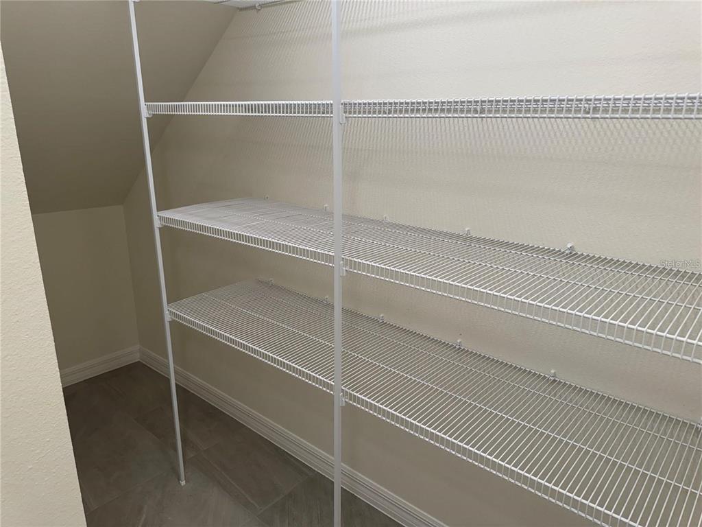 4561 Small Creek Road Kissimmee, FL 34744 - Photo 9 of 32 a view of a room with empty racks