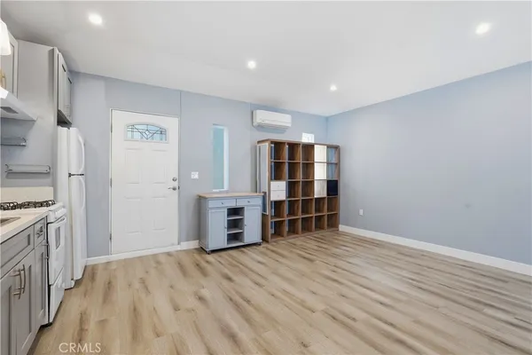 a view of room with wooden floor