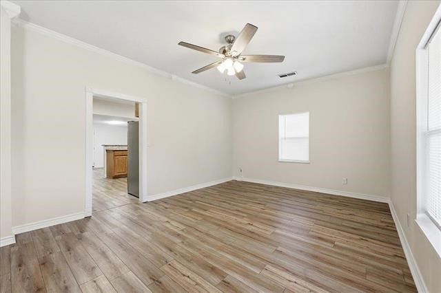 6309 32nd Street Groves, TX 77619 - Photo 16 of 34 a view of an empty room with wooden floor and a window