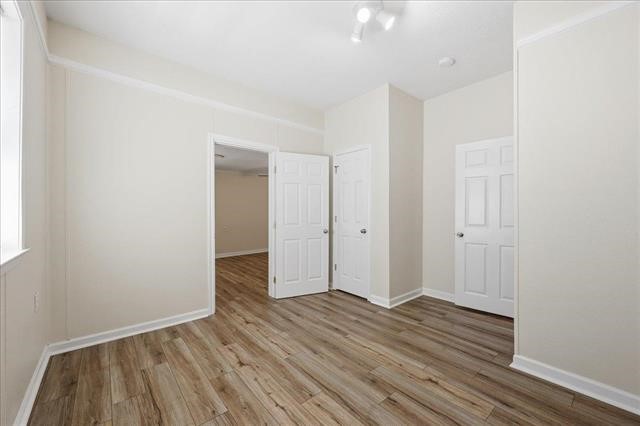 6309 32nd Street Groves, TX 77619 - Photo 18 of 34 wooden floor in an empty room