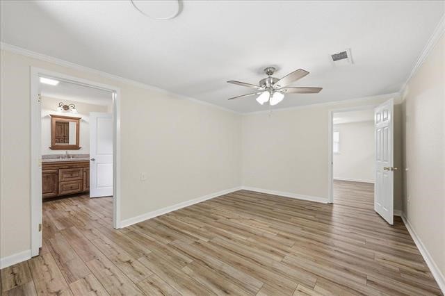 6309 32nd Street Groves, TX 77619 - Photo 19 of 34 wooden floor in an empty room with a window