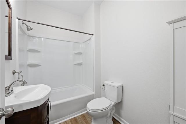 6309 32nd Street Groves, TX 77619 - Photo 28 of 34 a bathroom with a sink toilet and shower