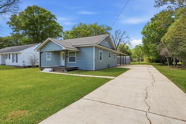 6309 32nd Street Groves, TX 77619 - Photo 3 of 34 a view of a house with a yard