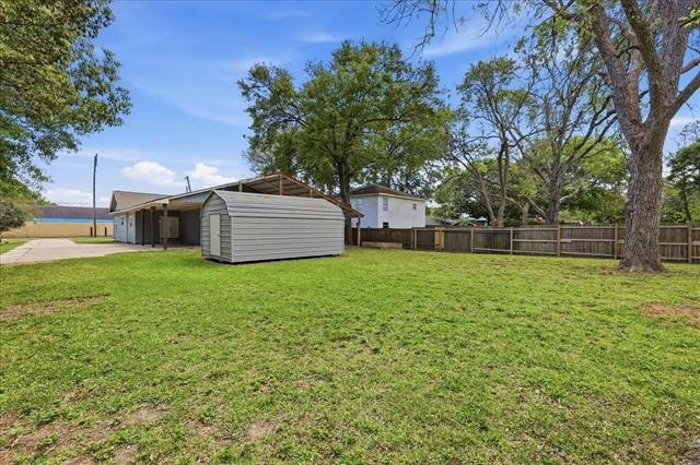 6309 32nd Street Groves, TX 77619 - Photo 33 of 34 a view of a backyard with large trees