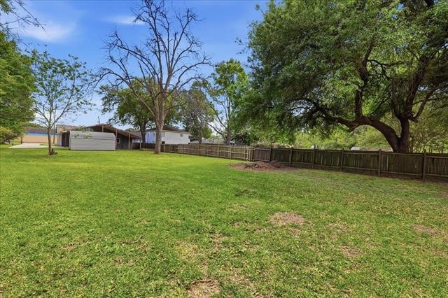 6309 32nd Street Groves, TX 77619 - Photo 34 of 34 a view of a backyard with a garden