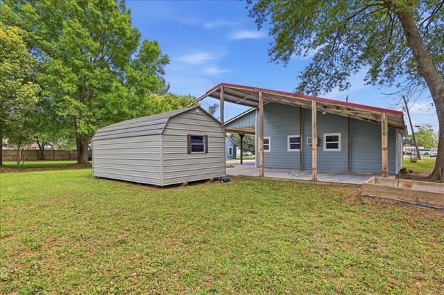 6309 32nd Street Groves, TX 77619 - Photo 4 of 34 a view of a house with a yard