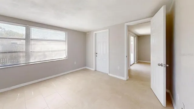 a view of an empty room with a window