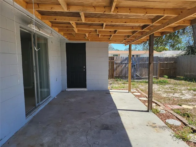 a view of wooden fence and a yard