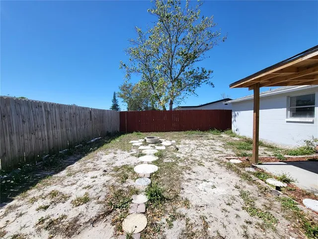 a view of a backyard of the house