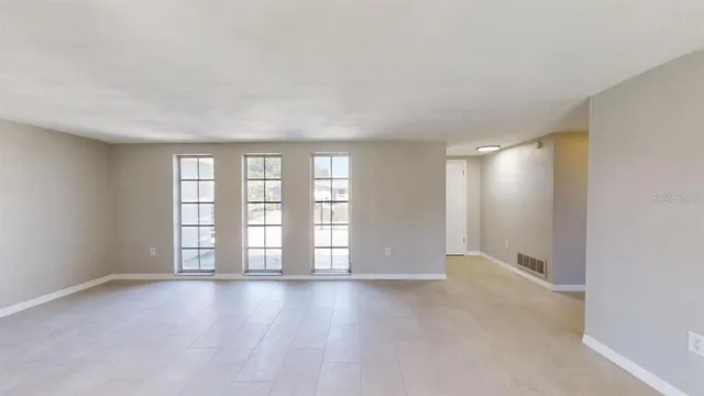 a view of an empty room with a window