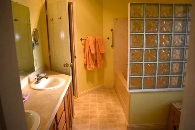 a bathroom with a sink and a mirror