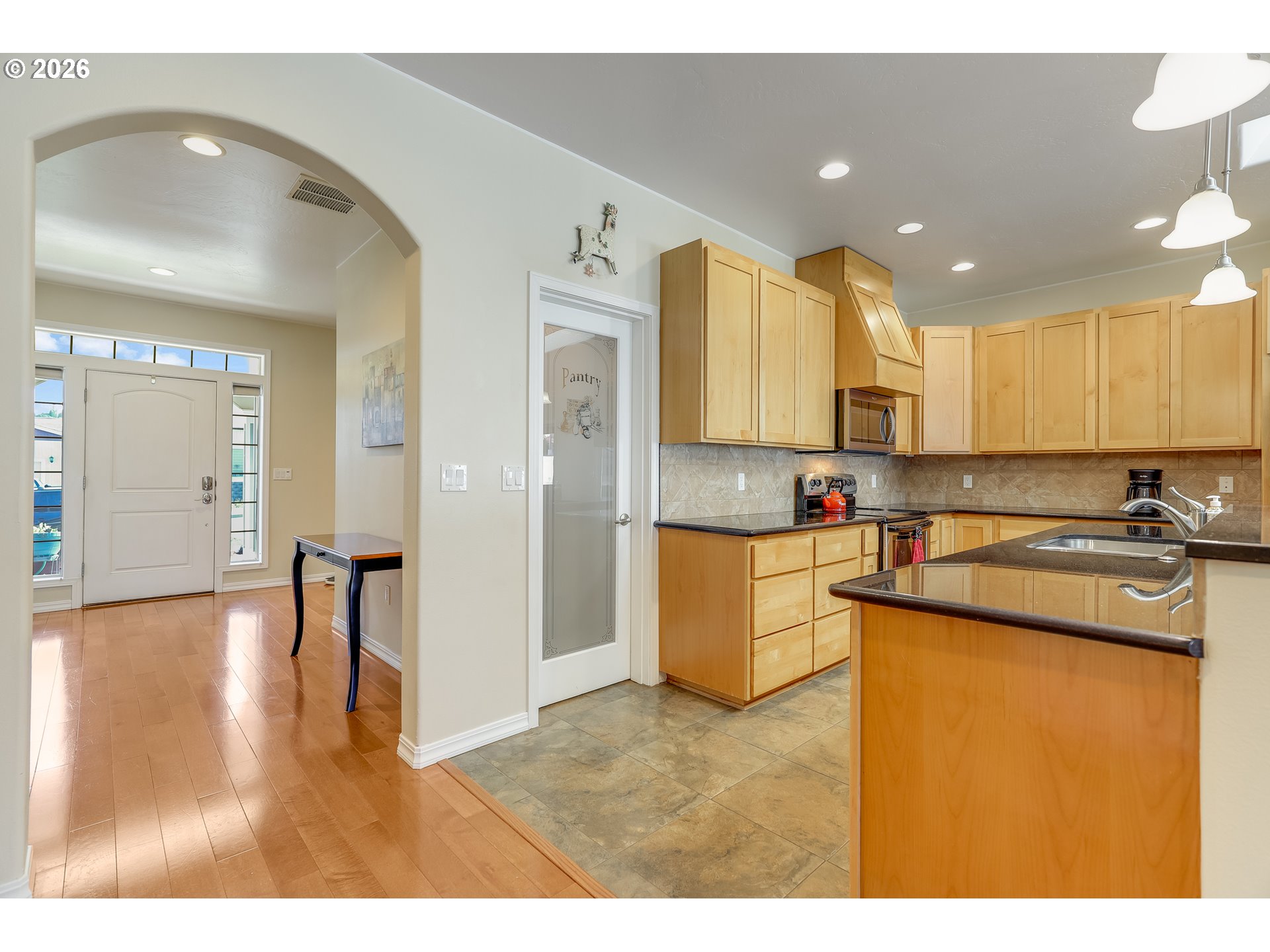 1901 Golden Way The Dalles, OR 97058 - Photo 13 of 48 a kitchen with stainless steel appliances granite countertop a refrigerator a stove and a sink