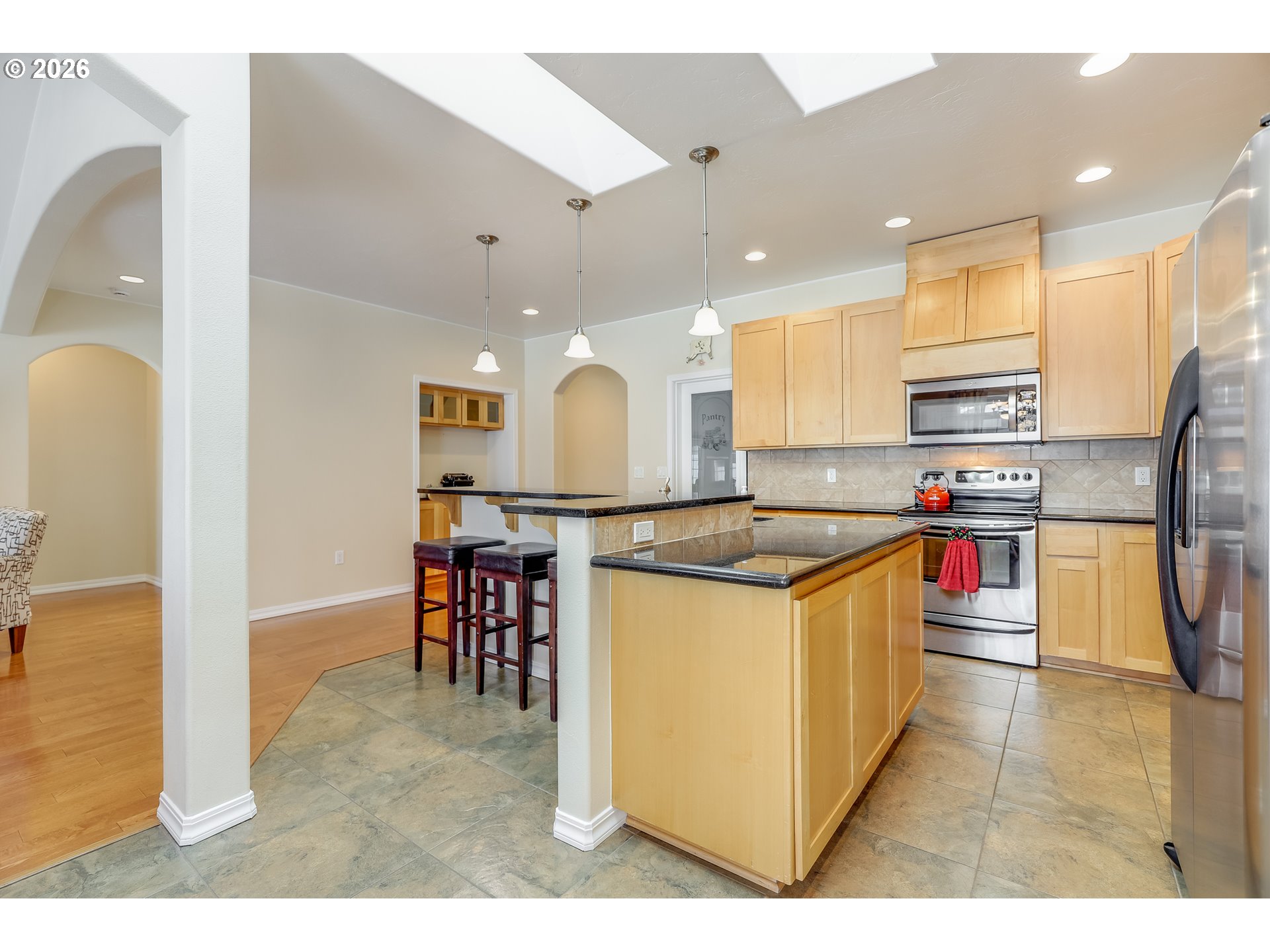 1901 Golden Way The Dalles, OR 97058 - Photo 21 of 48 a kitchen with stainless steel appliances granite countertop a refrigerator a oven and a sink