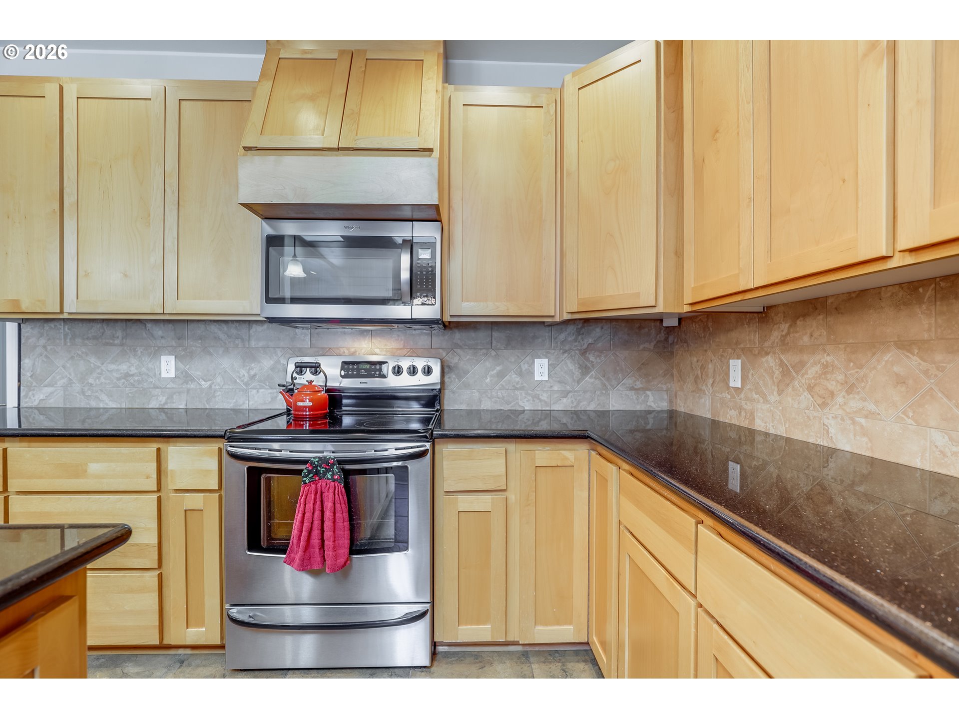 1901 Golden Way The Dalles, OR 97058 - Photo 24 of 48 a kitchen with stainless steel appliances granite countertop a sink and cabinets