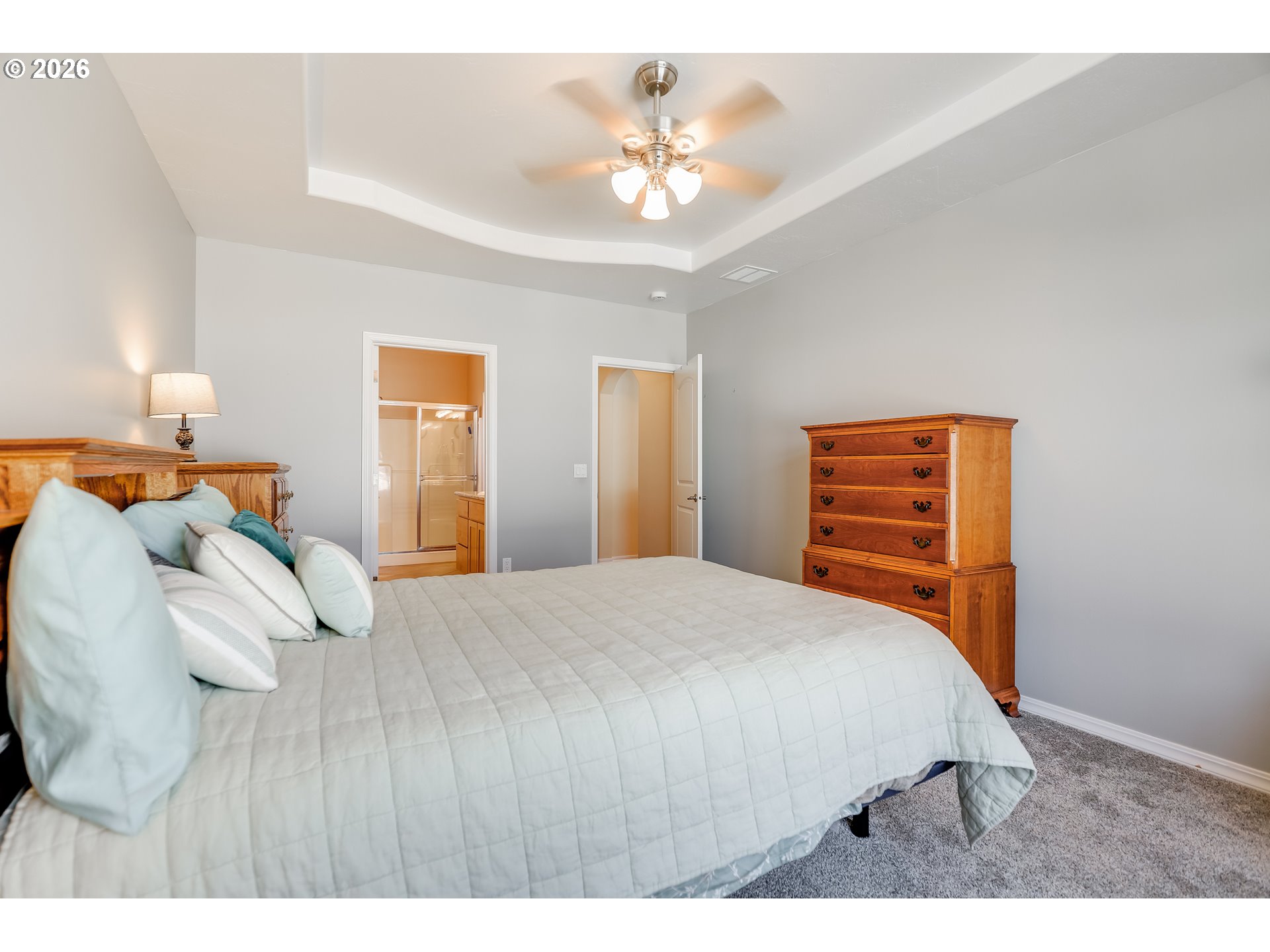 1901 Golden Way The Dalles, OR 97058 - Photo 34 of 48 a bedroom with a bed and a chandelier