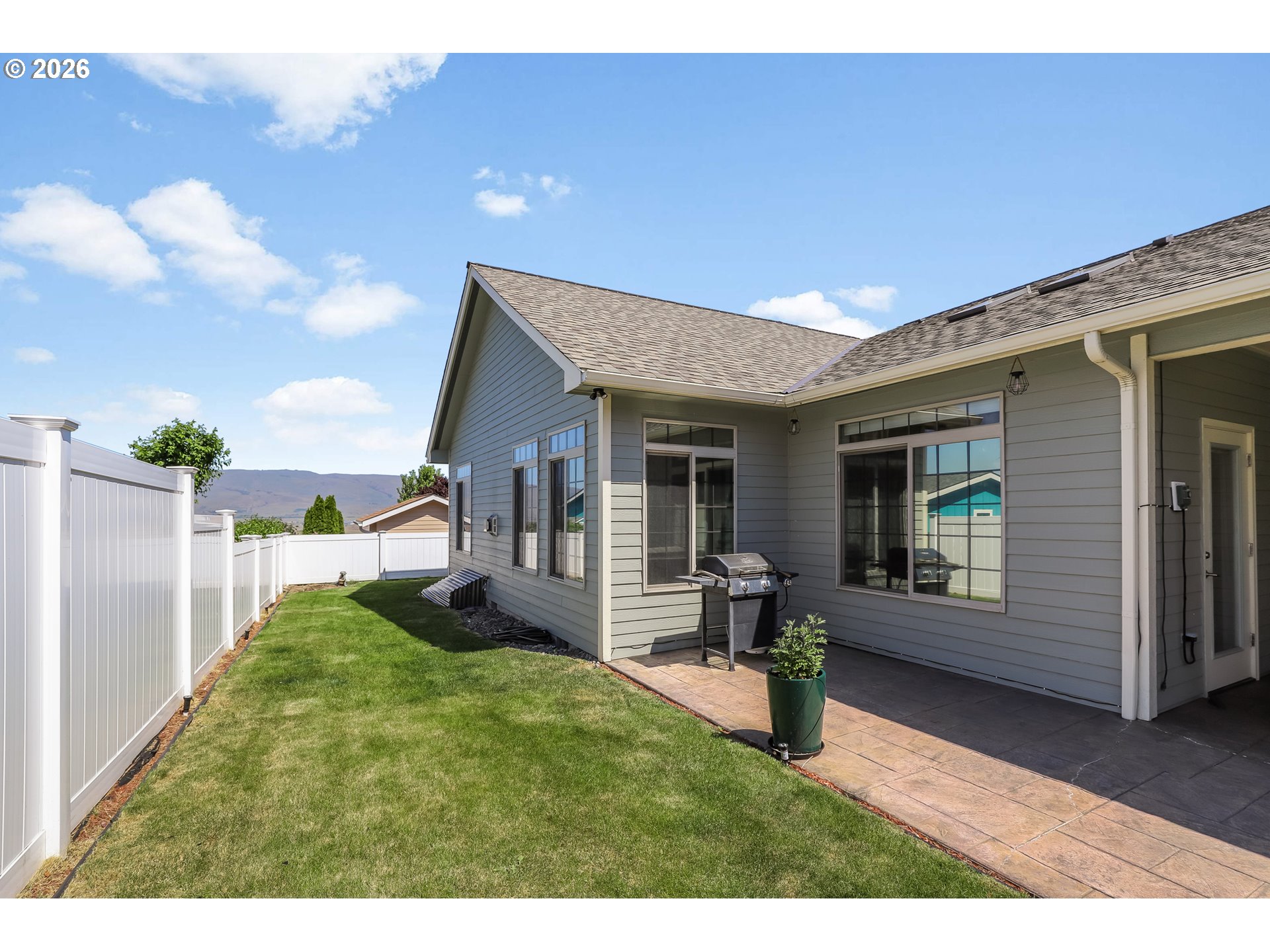 1901 Golden Way The Dalles, OR 97058 - Photo 47 of 48 a view of a house with backyard porch and wooden fence