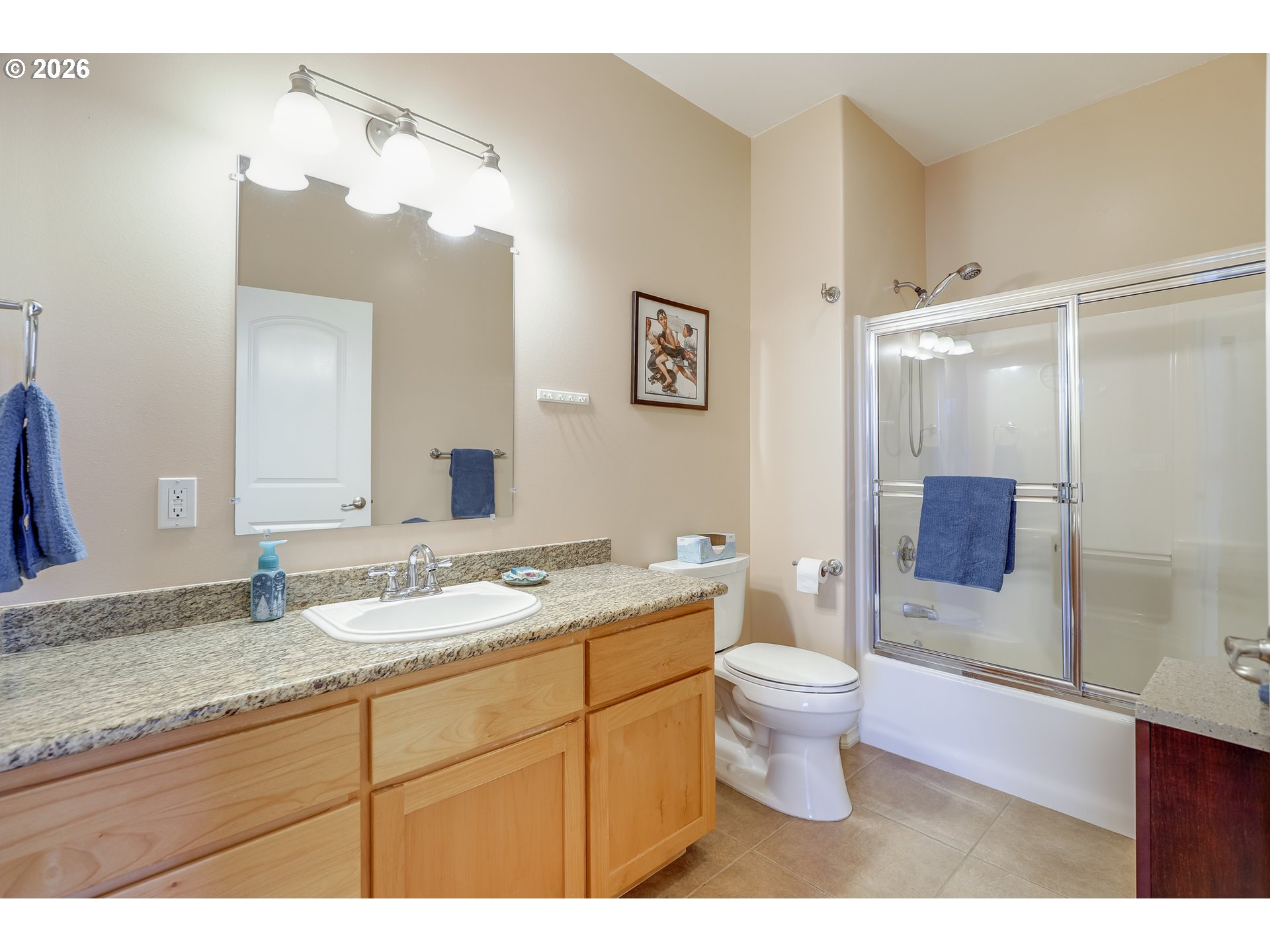 1901 Golden Way The Dalles, OR 97058 - Photo 8 of 48 a bathroom with a granite countertop sink a toilet a mirror and shower