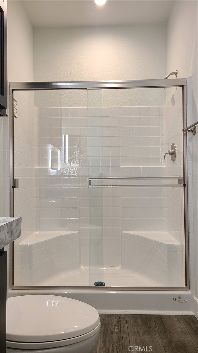2139 East 4th Street, Unit 79 Ontario, CA 91764 - Photo 15 of 18 a bathroom with a shower and a toilet