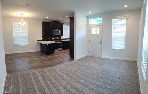 a view of kitchen with sink and window