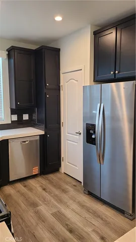 a kitchen with a refrigerator and a sink