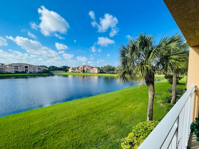 a view of a lake with houses in the back