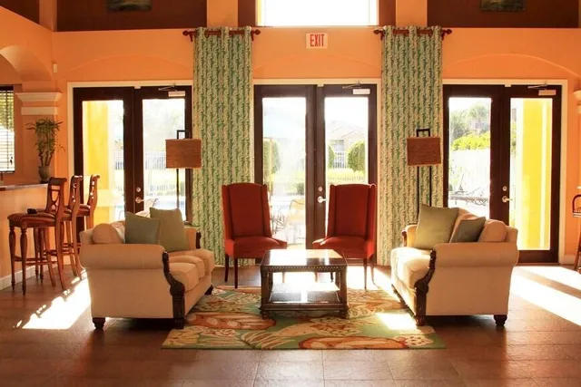 a living room with furniture and a large window