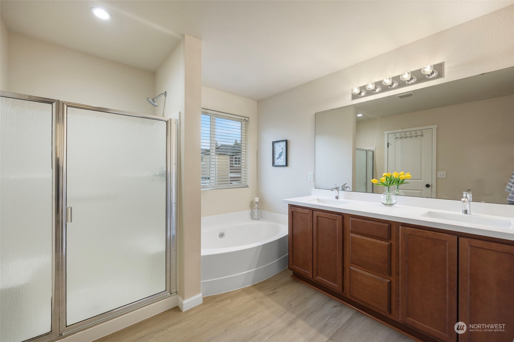 320 Graham Avenue Northeast Renton, WA 98059 - Photo 16 of 26 a bathroom with a tub sink and mirror