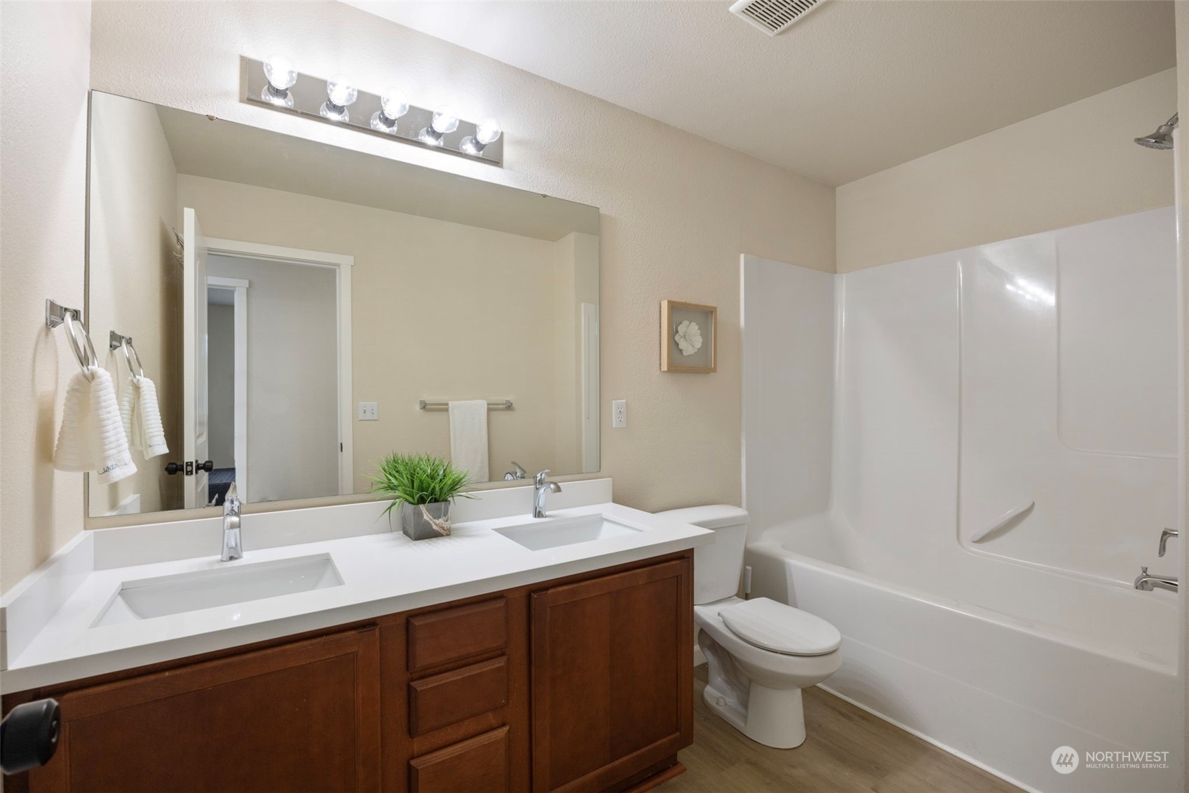 320 Graham Avenue Northeast Renton, WA 98059 - Photo 20 of 26 a bathroom with a double vanity sink toilet and shower