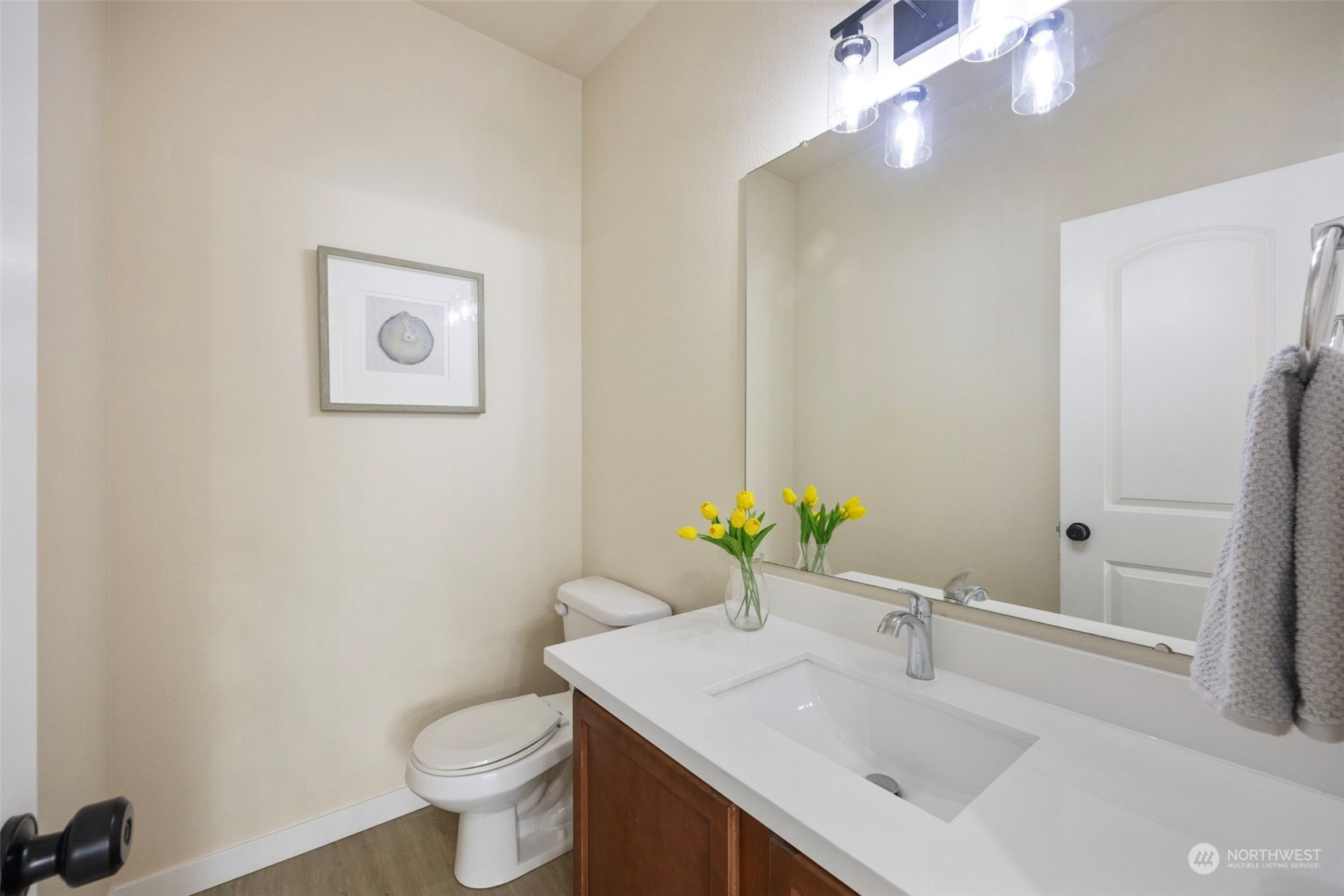 320 Graham Avenue Northeast Renton, WA 98059 - Photo 9 of 26 a bathroom with a sink toilet and vanity
