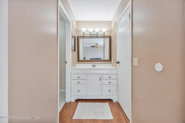 a room with a sink and a mirror