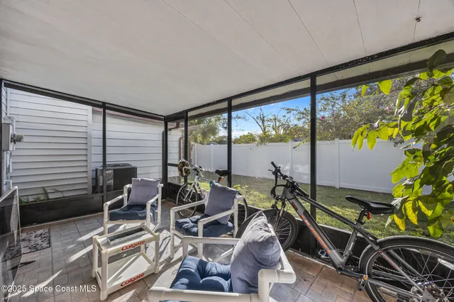 a room with gym equipment and a large window