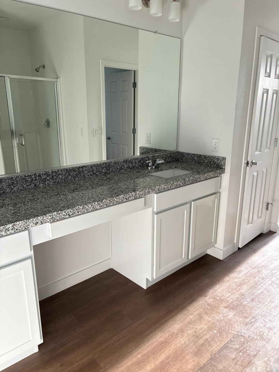5630 South Daisy Patch Place Phoenix, AZ 85040 - Photo 13 of 14 a bathroom with a sink and a mirror