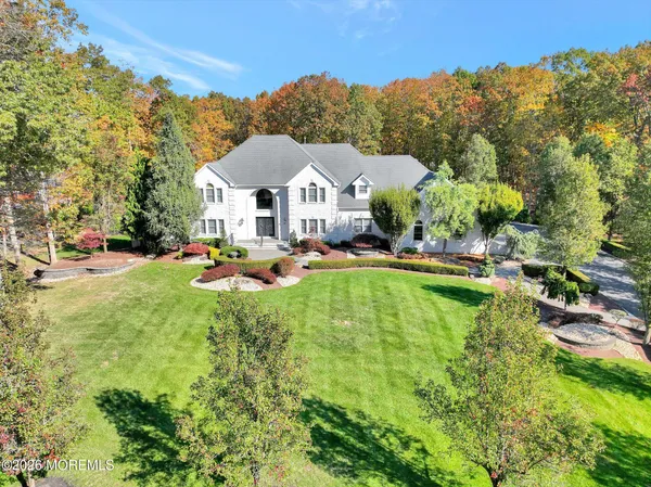 a view of a house with swimming pool and porch