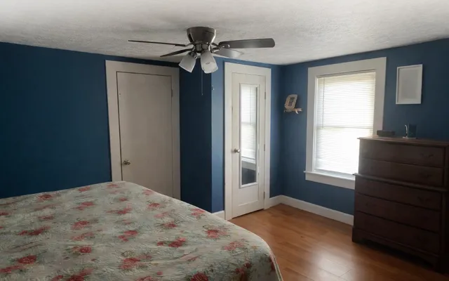 a bedroom with a bed and a dresser