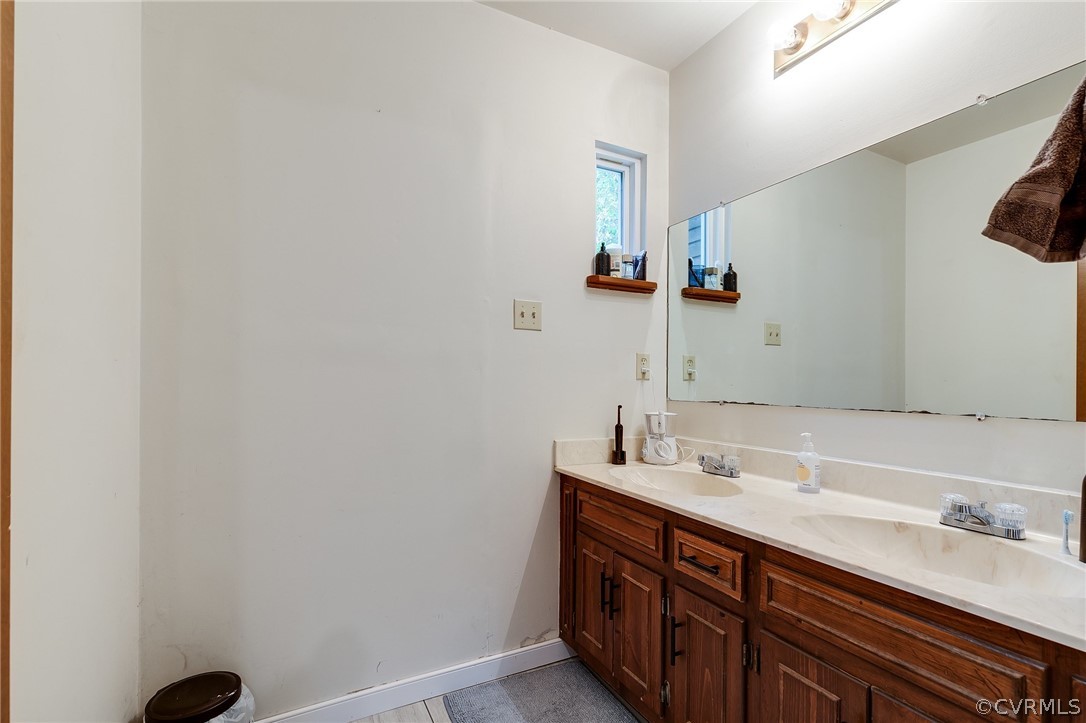 7413 Drexelbrook Road Chesterfield, VA 23832 - Photo 13 of 19 a bathroom with a sink and a mirror