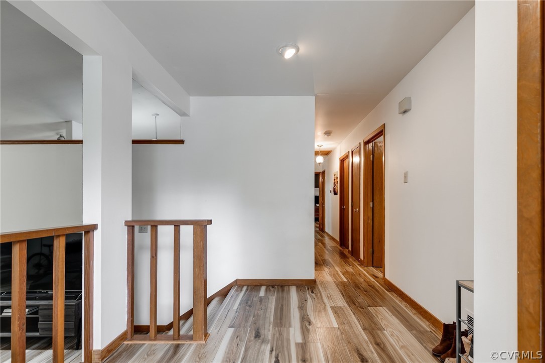 7413 Drexelbrook Road Chesterfield, VA 23832 - Photo 2 of 19 a view of hallway with stairs and wooden floor