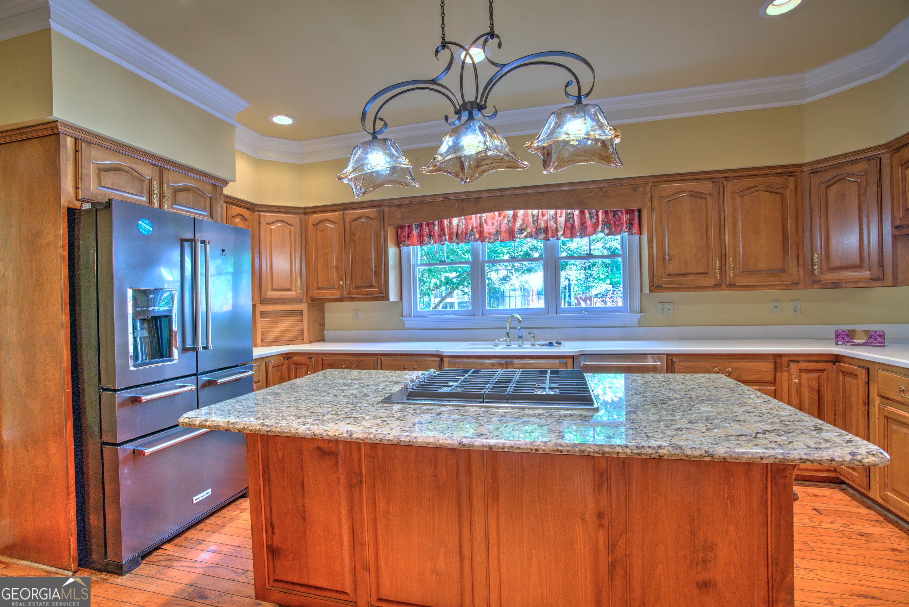 15 Ladonna Place Southwest Rome, GA 30165 - Photo 14 of 70 a kitchen with kitchen island granite countertop wooden cabinets a refrigerator and a stove