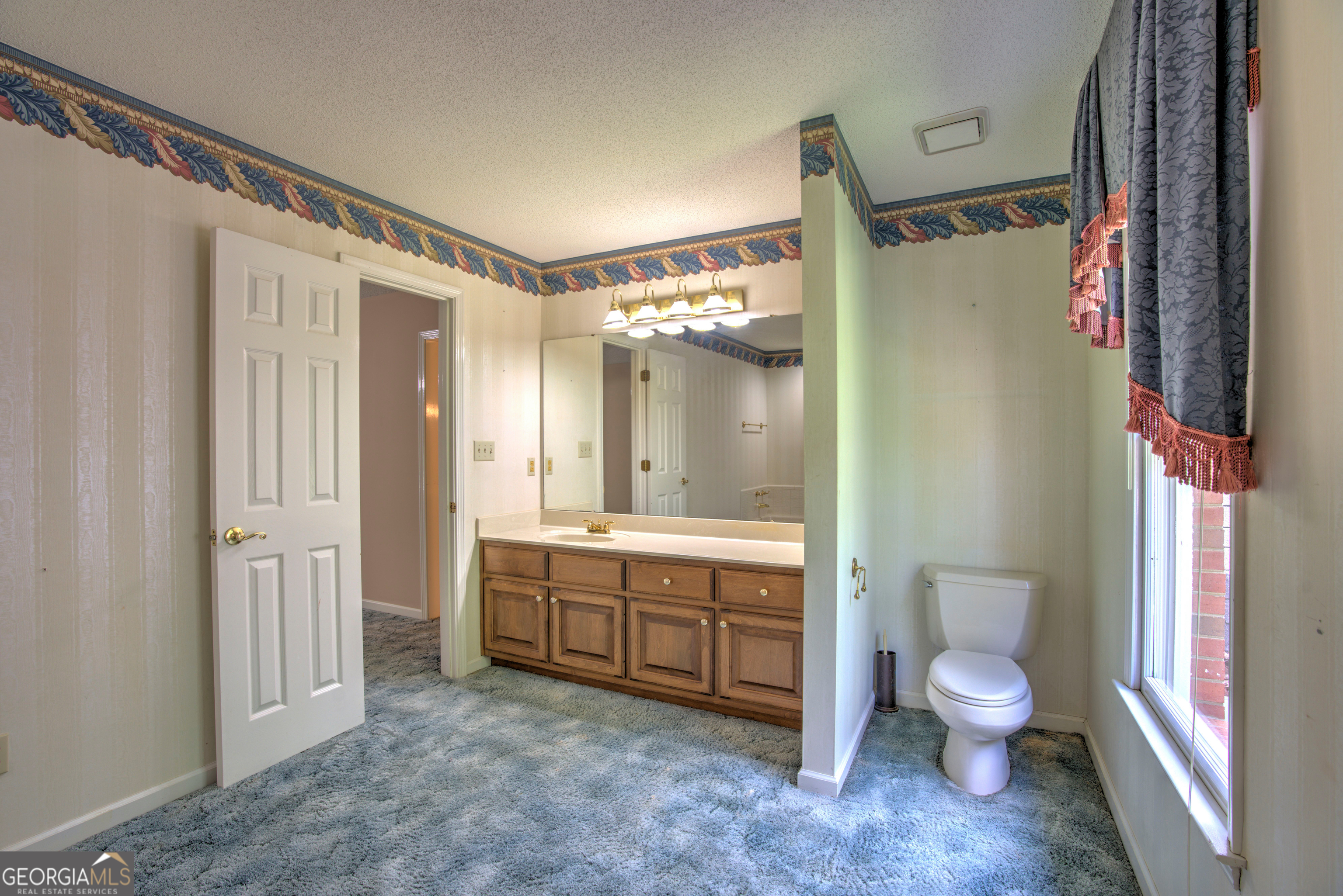 15 Ladonna Place Southwest Rome, GA 30165 - Photo 28 of 70 a bathroom with a granite countertop sink toilet and shower