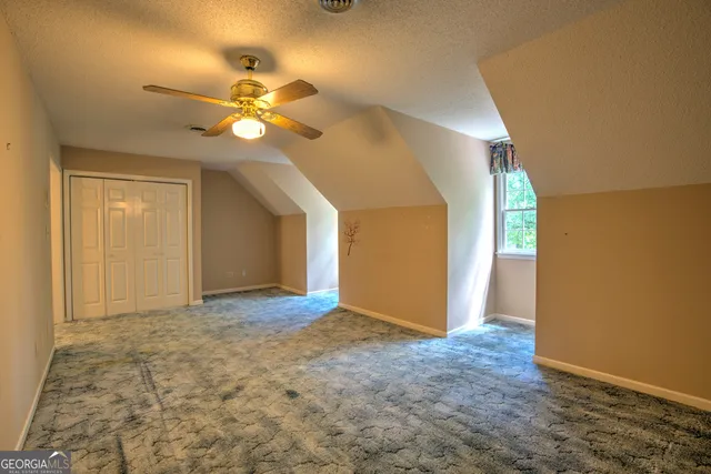 a view of a room with furniture and window