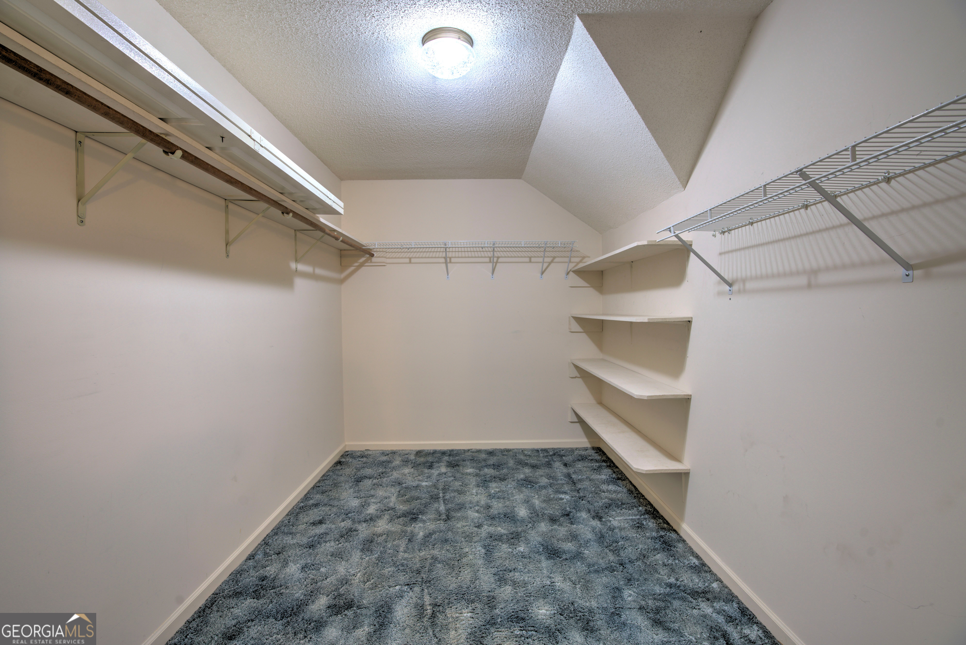 15 Ladonna Place Southwest Rome, GA 30165 - Photo 32 of 70 a view of a room with racks on the wall