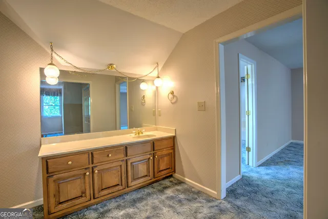 a kitchen with a stove and a microwave