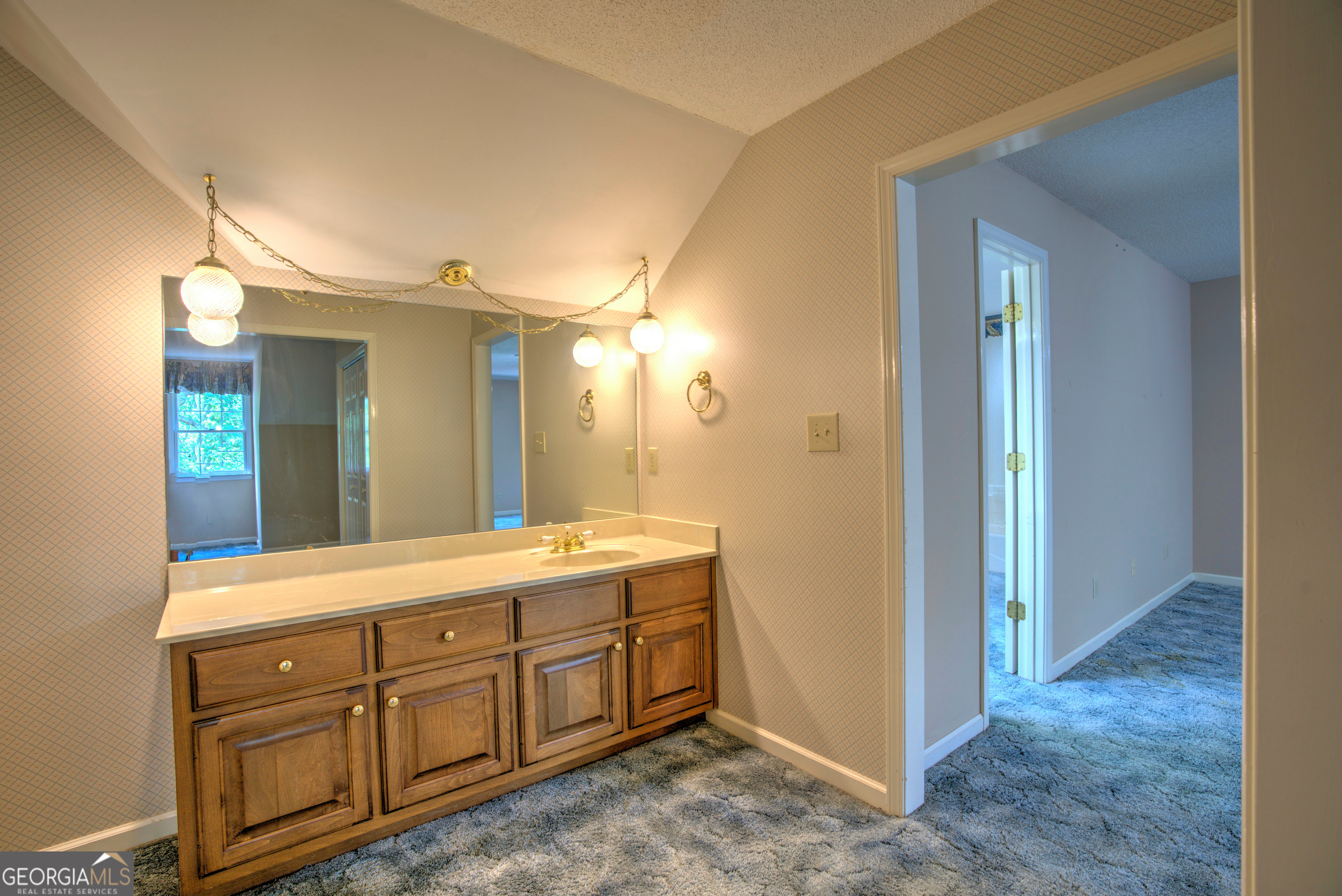 15 Ladonna Place Southwest Rome, GA 30165 - Photo 33 of 70 a spacious bathroom with a double vanity sink and a mirror
