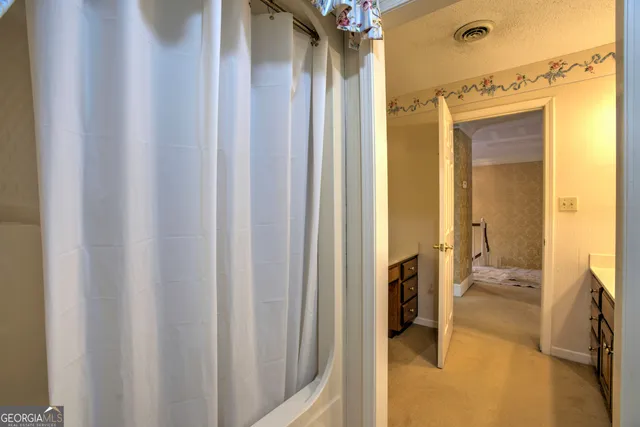 a kitchen with stainless steel appliances granite countertop a refrigerator sink and stove