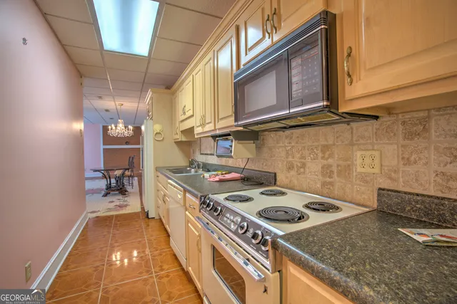 an aerial view of a house with yard and outdoor space