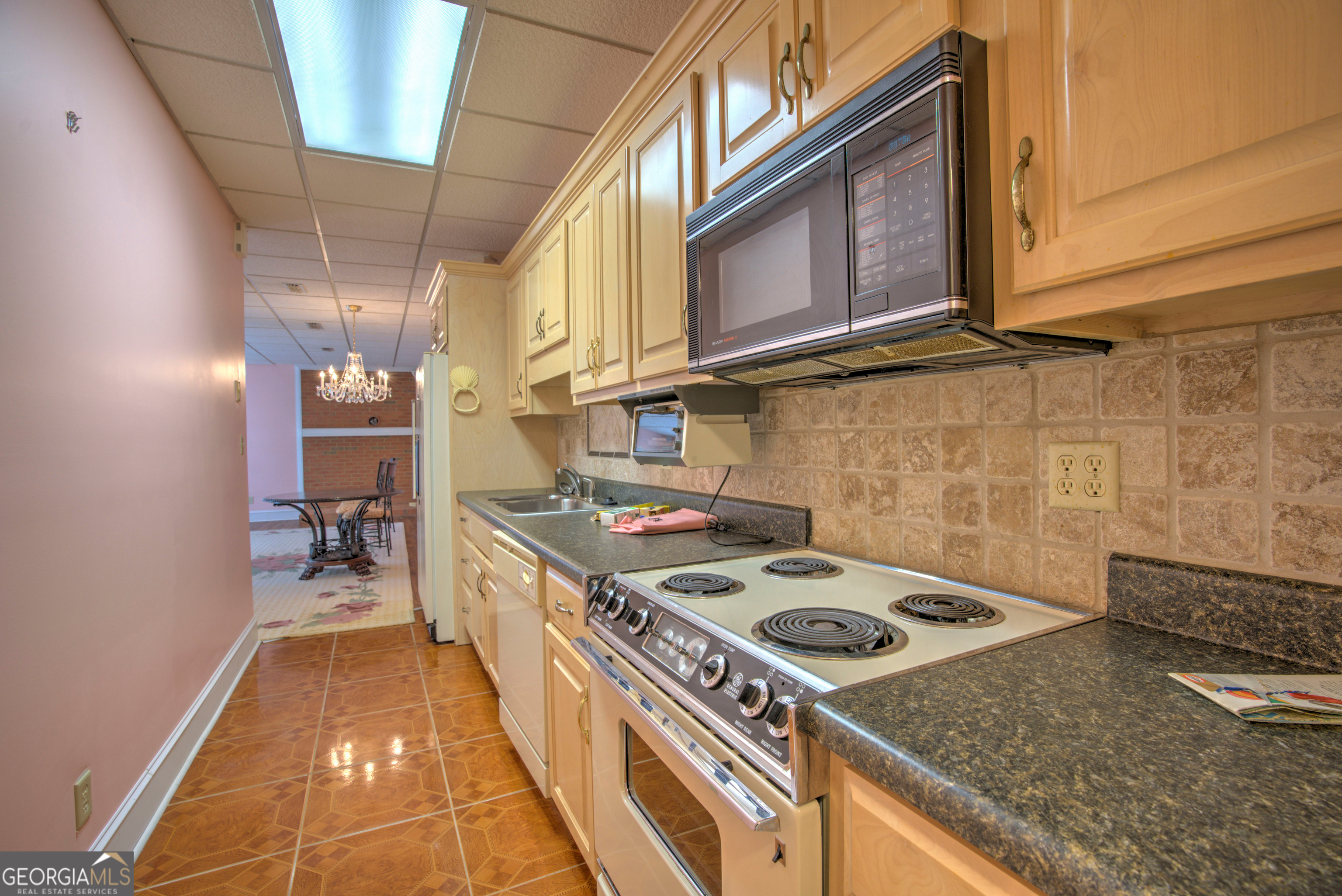 15 Ladonna Place Southwest Rome, GA 30165 - Photo 45 of 70 a kitchen with a stove and a microwave