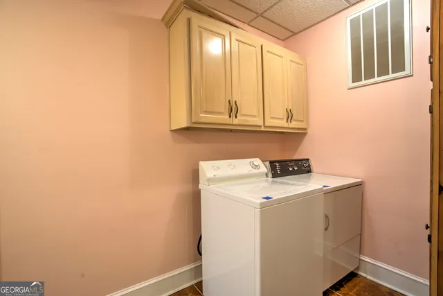 an aerial view of a house with swimming pool and garden