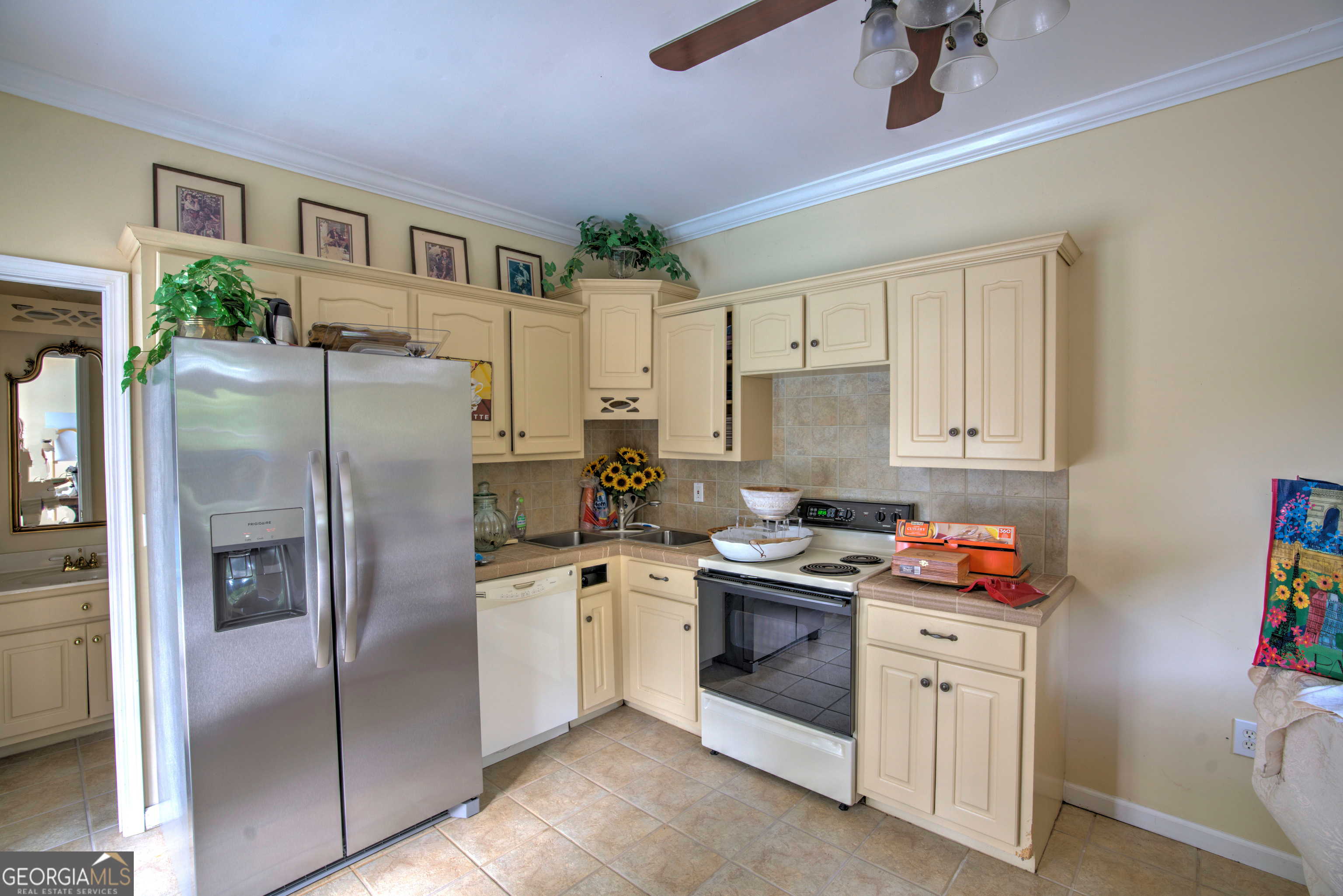 15 Ladonna Place Southwest Rome, GA 30165 - Photo 55 of 70 a kitchen with stainless steel appliances granite countertop a refrigerator sink and stove