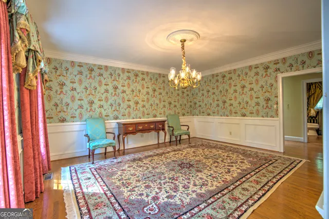 a kitchen with stainless steel appliances granite countertop wooden floors and sink
